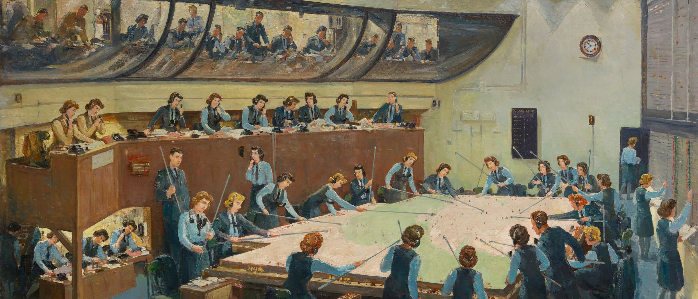 An operations room team building a shared picture from many incoming reports.